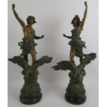 A pair of turn of the century French spelter classical figures with patinated finish. Height