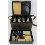 An early 20th century Burroughs Wellcome Tabloid brand medicine chest and contents in black toleware