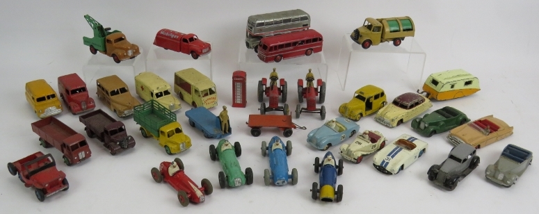 A collection of 33 vintage Die Cast Dinky toys cars, buses, vans, lorries, tractors etc. (33).