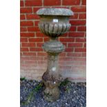 A nicely weathered reconstituted stone pedestal of baluster form, together with an associated fluted