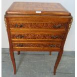 A vintage French oak side cabinet with parquetry top and ormolu mounts, housing three long drawers