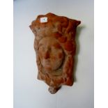 A vintage terracotta wall-hanging planter in the form of a classical maiden. Condition report: No