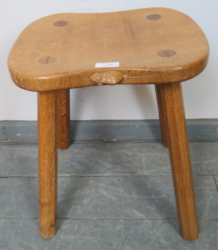 A light oak stool by Mouseman, on canted octagonal supports. Condition report: Some varnish loss