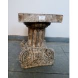 A vintage carved wooden plantstand in the form of a Corinthian column with ornately scrolled base,