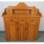 A Victorian pine chiffonier/sideboard, the shaped gallery with four short drawers, the base
