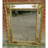A 19th century Napoleon III French cushion mirror with sectioned bevelled mirror plates, in an