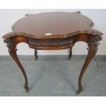 An Edwardian centre table with shaped top and acanthus carved frieze, on cabriole supports with