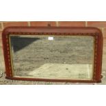 A Regency overmantle mirror in a parcel gilt walnut frame with parquetry inlay. Condition report: