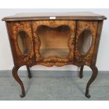 An Arts & Crafts penwork side cabinet, with glazed front, featuring foliate stencil decoration, on