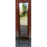 An Edwardian oak cheval mirror with turned finials, on splayed supports. Condition report: No