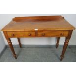 A Victorian walnut writing table, with rear gallery and two short drawers with turned wooden knob