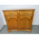 A good quality bespoke golden oak sideboard in the 18th century taste, featuring crossbanded inlay