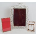 An antique silver plated scroll work photo frame, 35cm x 24cm, a smaller brass chain link photo