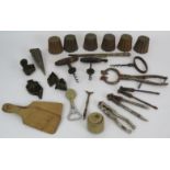 Six antique copper jelly moulds, three antique corkscrews, a brass crimper, biscuit cutters, Eastern