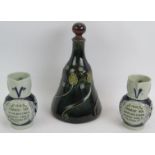An unusual Royal Doulton stoneware Art Nouveau flask decanter stamped 8894 and a pair of German