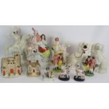 Twelve antique Staffordshire pottery figures including a pair of lustre spaniels, two brightly
