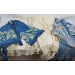 A vintage printed Kimono style robe, a similar Kimono style jacket, a cotton and lace petticoat, a