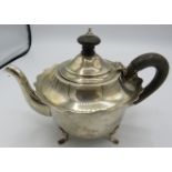 A bachelors silver teapot with embossed handle and finial. Birmingham 1902. 7.5 troy oz/ 236