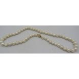 A strand of individually knotted freshwater cultured pearls with 9ct yellow gold ball clasp. Approx: