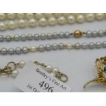 A double strand pearl necklace with faux sapphire & diamond clasp. Approx: 18" long. Boxed. A