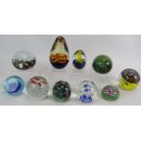 Ten decorative 20th century glass paperweights. Condition report: No issues.