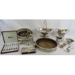 A mixed lot of mainly antique silver plated wares including a toast rack, mounted oak bowl, fruit