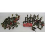 A quantity of vintage lead soldiers and a similar quantity of vintage plastic soldiers. (qty).