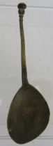A post Medieval cast brass latten spoon with seal top terminal and possible maker's mark to bowl.