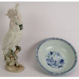A Royal Dux porcelain figure of a cockatoo, 39cm and a blue and white porcelain Chinese bowl, 26cm