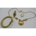 A 925 marked gilded pendant and bangle. A 14ct yellow and white fold ring with heart design. Size N.