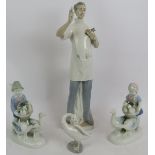 A Lladro Spanish porcelain figure of a dentist, a small Lladro goose and a pair of Bavarian Gerold