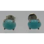 A pair of 925 stamped Cabochon amazonite stud earrings, backs marked 925. Condition repot: Good