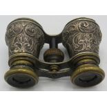 A pair of heavily embossed silver binoculars. Birmingham 1890. Condition report: Part of the rim