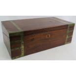 A Regency period mahogany writing slope, brass bound with interior fittings, secret drawers and a