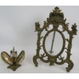 A cast brass Rococo style easel picture frame and a carved shell double perfume bottle holder with