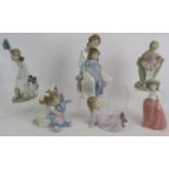 Six various Spanish porcelain NAO figurines of children in various poses. Tallest 23cm. (6).