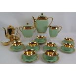 A 21 piece Gilt and Green Limoges R.G. Montigny tea set, comprising: tea pot, milk jug, sugar