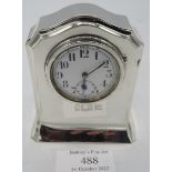 A small silver cased mantle clock. Birmingham 1913. Approx: 4" high, Mappin & Webb. Condition