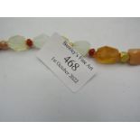 A Mexican fire opal rough cut faceted nuggets with 22ct hand made spacers and 9ct yellow gold