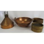 A large heavy copper bowl with rivetted handles, diameter 42cm, a large copper funnel/light shade