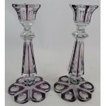 A pair of Bohemian crystal flash cut amethyst candle sticks with hollow stems and petal shapes