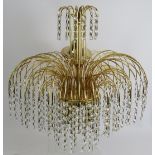 A five tier gilt metal crystal glass chandelier with four bulb fitting. Overall height 50cm.
