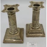 A pair of silver Corinthian columan candlesticks, Approx: 5" high. Birmingham 1902. Condition