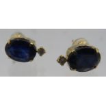 A pair of 18ct yellow gold stud earrings set with treated sapphires and diamonds. Sapphires 3.00