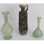 Three hand blown Roman style glass flasks, one with handle. Tallest 19cm. (3). Condition report: