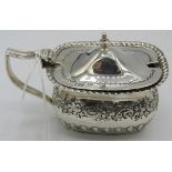 A silver mustard pot with half fluting and engraved decoration. Sheffield 1895, silver weight: 2.7