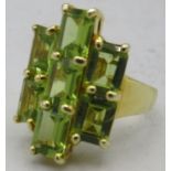 Peridot ring, faceted octagon cut stones of good cut & clarity. A large 22 x 15mm overall size. Size