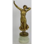 An Art Deco gilded Spelter figure of a semi nude female dancer in the style of Lorenzl. Mounted on