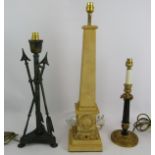 Three contemporary table lamps of classical design including a tall obelisk, bronzed triple arrow