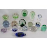 A collection of 15 glass paperweights of various design including goldfish, bees, birds and